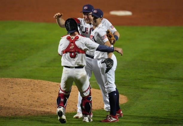 Todd Frazier, David Robertson, and Mark Kolozsvary of United States celebrate defeating Venezuela by score of 4-2 during the WBSC Baseball Americas...