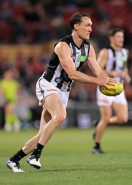 Jack Madgen of the Magpies kicks the ball during the round 12 AFL match between the Adelaide Crows and the Collingwood Magpies at Adelaide Oval on...