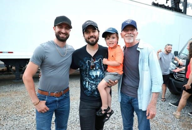 Cody Villalobos, country artist Scott Stevens, son Henry Stevens and L3Entertainment's Peter Hartung are seen backstage at Hop Springs on June 05,...