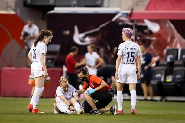 Jessica Fishlock of OL Reign is attended to by medical staff during the second half of the game against NJ/NY Gotham FC at Red Bull Arena on June 5,...