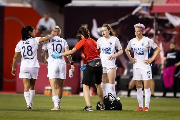 Jessica Fishlock of OL Reign is helped off the field during the second half of the game against NJ/NY Gotham FC at Red Bull Arena on June 5, 2021 in...