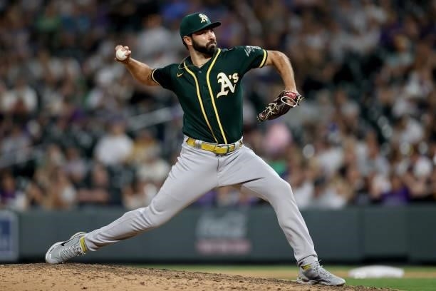Pitcher Lou Trivino of the Oakland Athletics throws against the Colorado Rockies in the ninth inning at Coors Field on June 05, 2021 in Denver,...