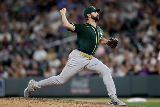 Pitcher Lou Trivino of the Oakland Athletics throws against the Colorado Rockies in the ninth inning at Coors Field on June 05, 2021 in Denver,...