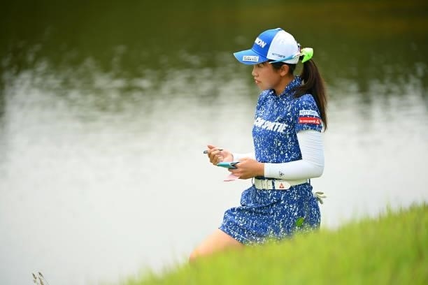 Nana Suganuma of Japan checks her yardage book on her way to the 18th tee during the final round of Yonex Ladies at Yonex Country Club on June 6,...