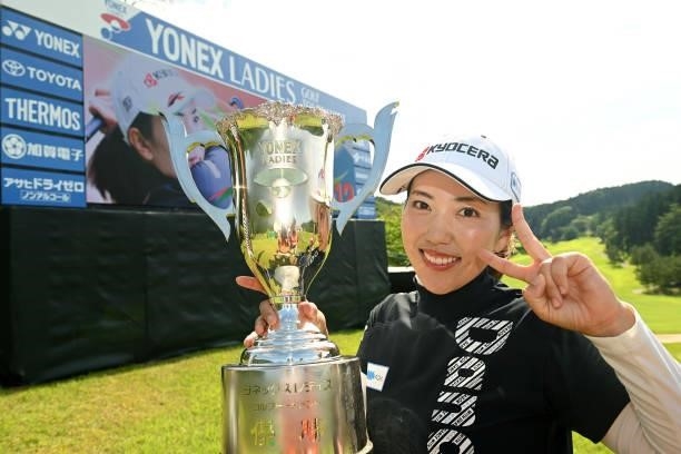 Ritsuko Ryu of Japan poses with the trophy after winning the tournament following the final round of Yonex Ladies at Yonex Country Club on June 6,...