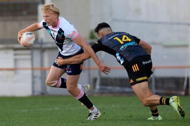 Carter Gordon of the Rebels is tackled by Shaun Stevenson of the Chiefs during the round four Super Rugby Trans-Tasman match between the Chiefs and...