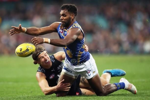 Liam Ryan of the Eagles is challenged by Liam Stocker of the Blues during the round 12 AFL match between the Carlton Blues and the West Coast Eagles...