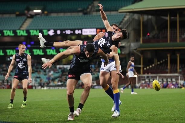 Nic Newman of the Blues falls heavily contesting the ball during the round 12 AFL match between the Carlton Blues and the West Coast Eagles at Sydney...