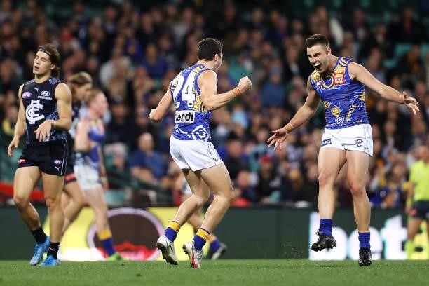 Xavier O'Neill of the Eagles celebrates with Elliot Yeo of the Eagles after kicking a goal during the round 12 AFL match between the Carlton Blues...