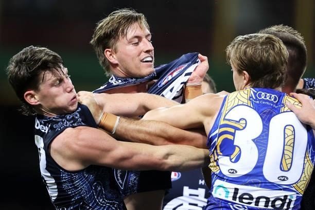 Jackson Nelson of the Eagles intervenes as Elliot Yeo of the Eagles scuffles with Sam Walsh, Will Setterfield and Patrick Cripps of the Blues during...