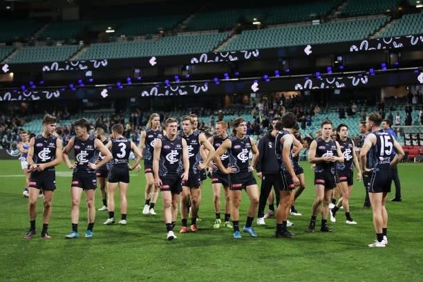 Blues players look dejected after the round 12 AFL match between the Carlton Blues and the West Coast Eagles at Sydney Cricket Ground on June 06,...