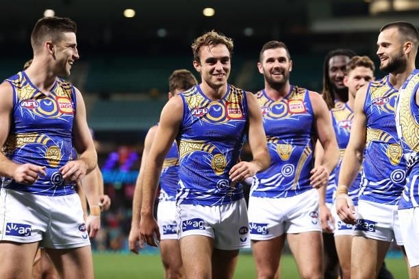 Luke Edwards of the Eagles leads his team off as they celebrate victory during the round 12 AFL match between the Carlton Blues and the West Coast...