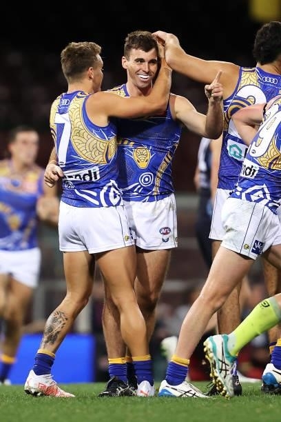 Jamie Cripps of the Eagles celebrates with his team mates after kicking a goal during the round 12 AFL match between the Carlton Blues and the West...