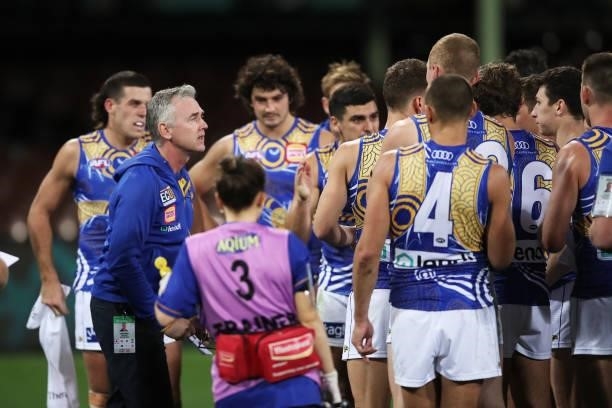 Eagles head coach Adam Simpson speaks to players at three quarter time during the round 12 AFL match between the Carlton Blues and the West Coast...