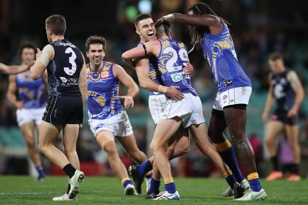 Luke Foley of the Eagles celebrates with team mates after kicking a goal during the round 12 AFL match between the Carlton Blues and the West Coast...