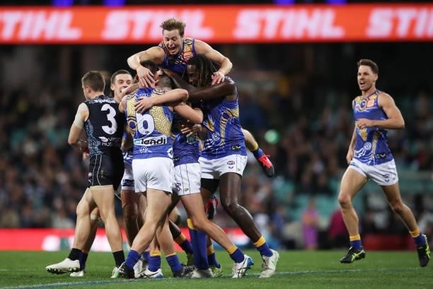 Luke Foley of the Eagles celebrates with team mates after kicking a goal during the round 12 AFL match between the Carlton Blues and the West Coast...