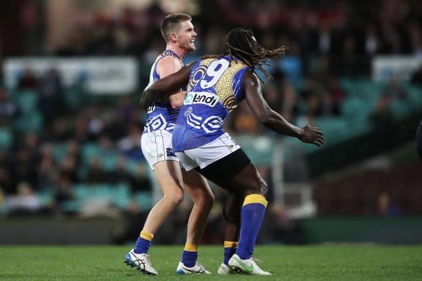 Luke Foley of the Eagles celebrates with Nic Naitanui after kicking a goal during the round 12 AFL match between the Carlton Blues and the West Coast...