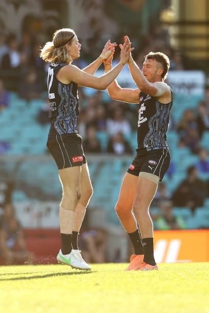 Tom De Koning of the Blues celebrates kicking a goal with Patrick Cripps of the Blues during the round 12 AFL match between the Carlton Blues and the...