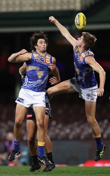 Tom Barrass and Harry Edwards of the Eagles contest the ball during the round 12 AFL match between the Carlton Blues and the West Coast Eagles at...