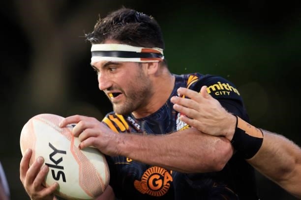 Luke Jacobson of the Chiefs is tackled during the round four Super Rugby Trans-Tasman match between the Chiefs and the Melbourne Rebels at Leichhardt...