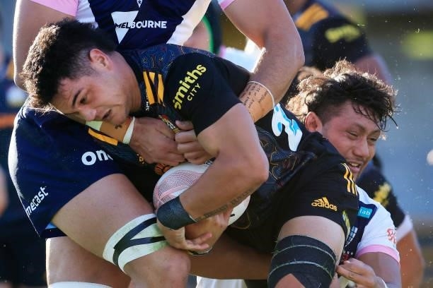 Quinn Tupaea of the Chiefs is tackled during the round four Super Rugby Trans-Tasman match between the Chiefs and the Melbourne Rebels at Leichhardt...