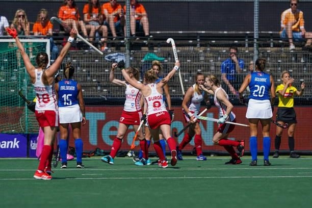 Jo Hunter of England, Esme Burge of England and their team-mates celebrate their second goal during the Euro Hockey Championships match between...