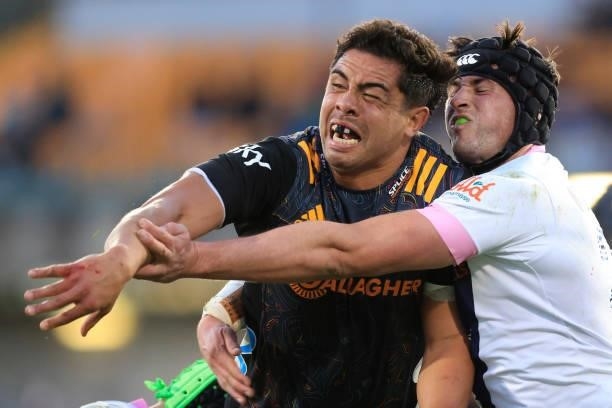 Anton Lienert-Brown of the Chiefs offloads during the round four Super Rugby Trans-Tasman match between the Chiefs and the Melbourne Rebels at...
