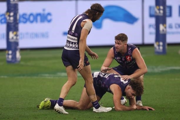 Luke Ryan of the Dockers checks on Griffin Logue during the round 12 AFL match between the Fremantle Dockers and the Western Bulldogs at Optus...