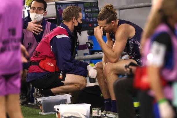 Nat Fyfe of the Dockers reacts on the bench after coming from the field with a shoulder injury during the round 12 AFL match between the Fremantle...