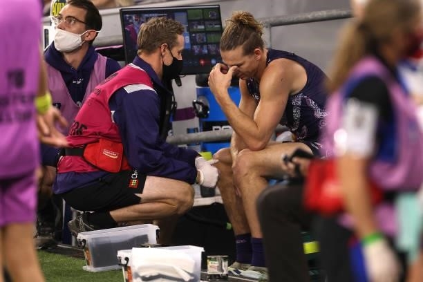 Nat Fyfe of the Dockers reacts on the bench after coming from the field with a shoulder injury during the round 12 AFL match between the Fremantle...