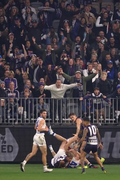 Liam Henry of the Dockers looks to the umpire after tackling Alex Keath of the Bulldogs during the round 12 AFL match between the Fremantle Dockers...