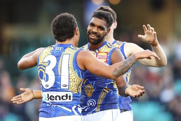 Jamaine Jones of the Eagles celebrates with Liam Ryan of the Eagles after kicking goal during the round 12 AFL match between the Carlton Blues and...