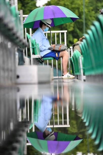 Man awaits play to resume as rain delays play during day 2 of the Viking Open at Nottingham Tennis Centre on June 06, 2021 in Nottingham, England.