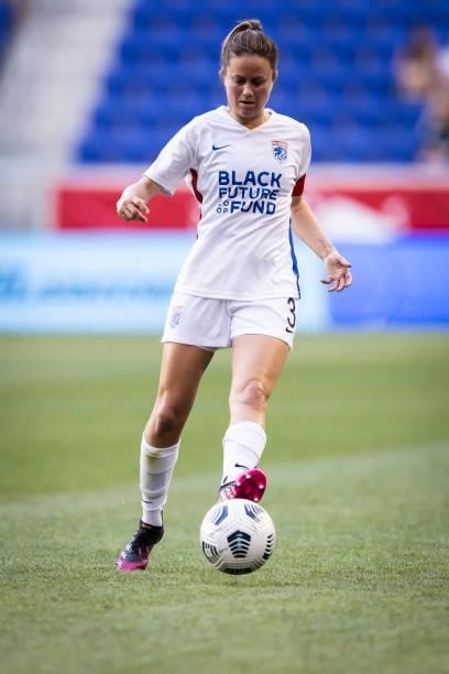 Lauren Barnes of OL Reign drives the ball down the pitch during the first half of the match against NJ/NY Gotham FC at Red Bull Arena on June 5, 2021...
