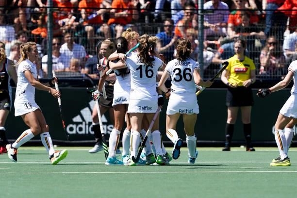 Belgium players celebrate scoring the first goal during the Euro Hockey Championships match between Germany and Belgium at Wagener Stadion on June 6,...