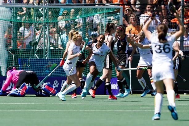 Belgium players celebrate scoring the first goal during the Euro Hockey Championships match between Germany and Belgium at Wagener Stadion on June 6,...