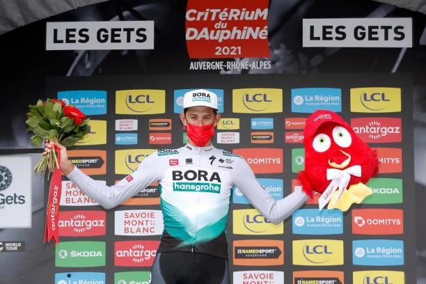 Nils Politt of Germany and Team Bora - Hansgrohe celebrates at podium Most Combative Rider Trophy during the 73rd Critérium du Dauphiné 2021, Stage 8...
