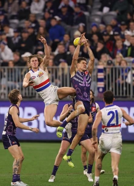 Aaron Naughton of the Bulldogs and Rory Lobb of the Dockers contest for a mark during the round 12 AFL match between the Fremantle Dockers and the...