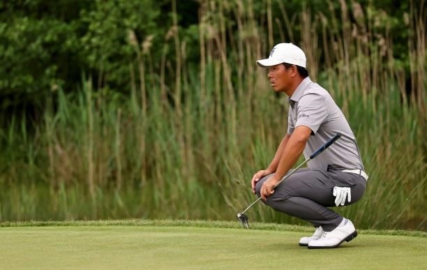 Ashun Wu of China on the 6th green during the second round of The Porsche European Open at Green Eagle Golf Course on June 06, 2021 in Hamburg,...