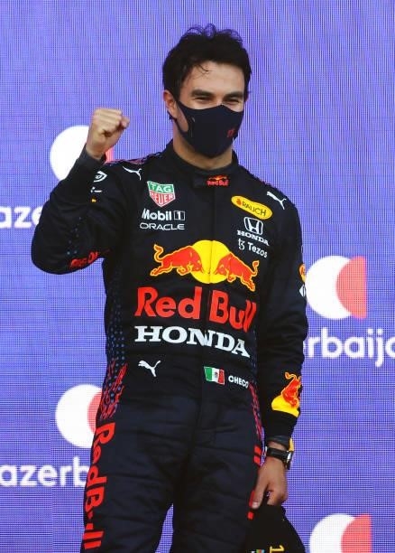 Race winner Sergio Perez of Mexico and Red Bull Racing celebrates on the podium during the F1 Grand Prix of Azerbaijan at Baku City Circuit on June...