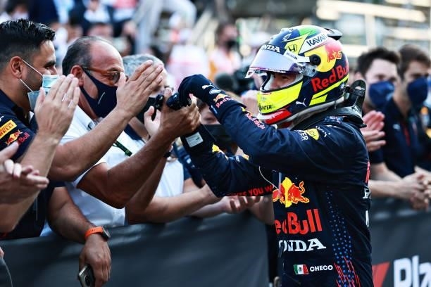 Race winner Sergio Perez of Mexico and Red Bull Racing celebrates with his team in parc ferme during the F1 Grand Prix of Azerbaijan at Baku City...