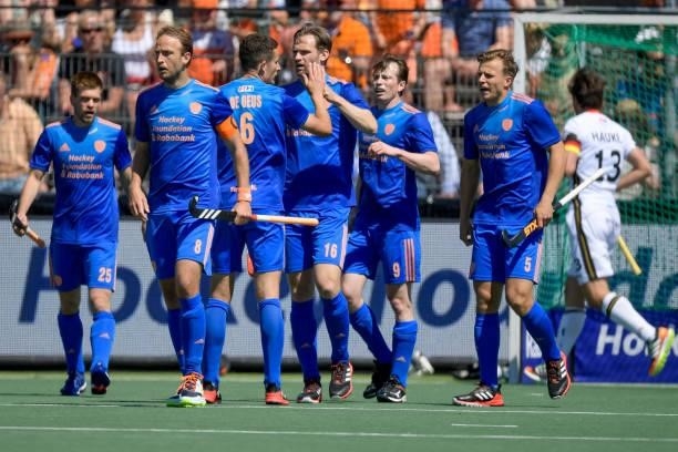 Players of the Netherlands celebrate their teams first goal during the Euro Hockey Championships match between Germany and Netherlands at Wagener...