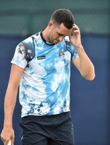 James Ward of Great Britain plays reacts as he plays against Marius Copil of Romania during day 2 of the Viking Open at Nottingham Tennis Centre on...