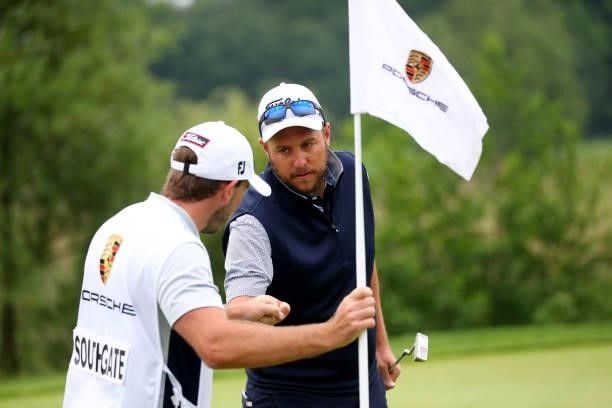 Matthew Southgate of England and his caddie on the 9th green during the second round of The Porsche European Open at Green Eagle Golf Course on June...