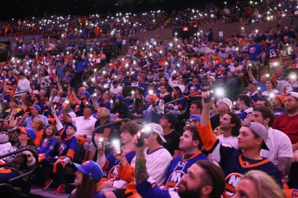 Fans hold up their lights prior to the game between the New York Islanders and the Boston Bruins in Game Four of the Second Round of the 2021 NHL...