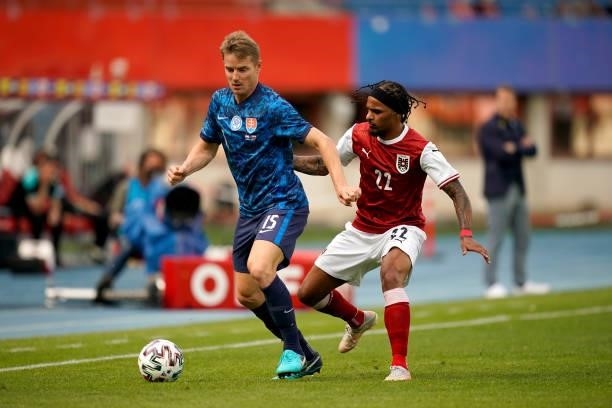 Tomas Hubocan of Slovakia battles for possession with Valentino Lazaro of Austria during the international friendly match between Austria and...