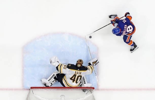 Tuukka Rask of the Boston Bruins defends against Anthony Beauvillier of the New York Islanders in Game Four of the Second Round of the 2021 NHL...
