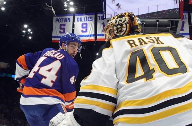 Tuukka Rask of the Boston Bruins defends against Jean-Gabriel Pageau of the New York Islanders in Game Four of the Second Round of the 2021 NHL...