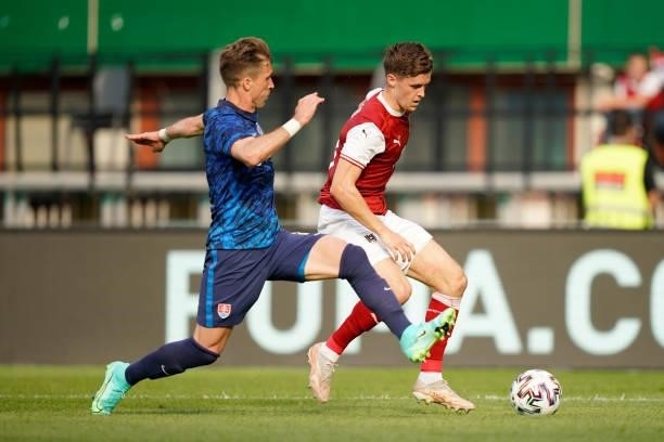 Christoph Baumgartner of Austria battles for possession with Peter Pekarik of Slovakia during the international friendly match between Austria and...
