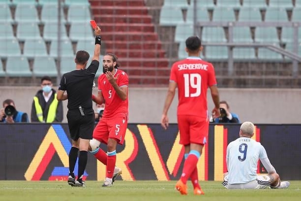 Vahid Selimovic of Luxembourg is shown a red card by Match Referee, Eldorjan Hamiti during the international friendly match between Luxembourg and...